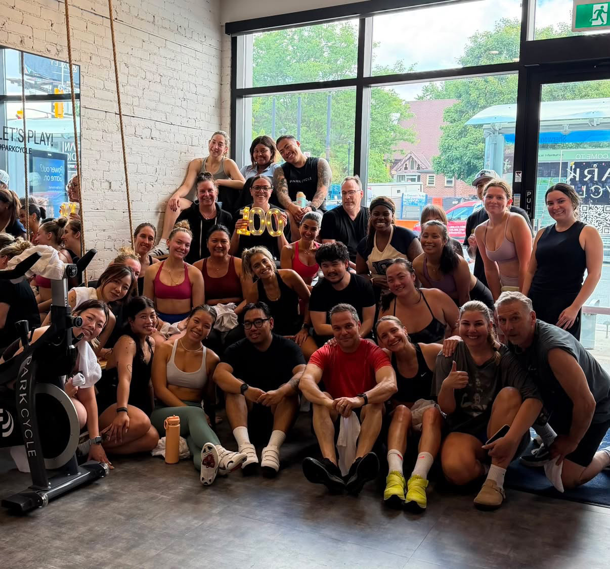 Park Cycle members celebrating together at the studio